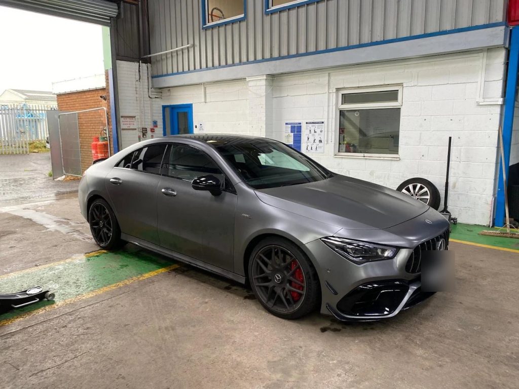 Matte grey Mercedes-AMG CLA 45 S outside the Liam's Tyres workshop